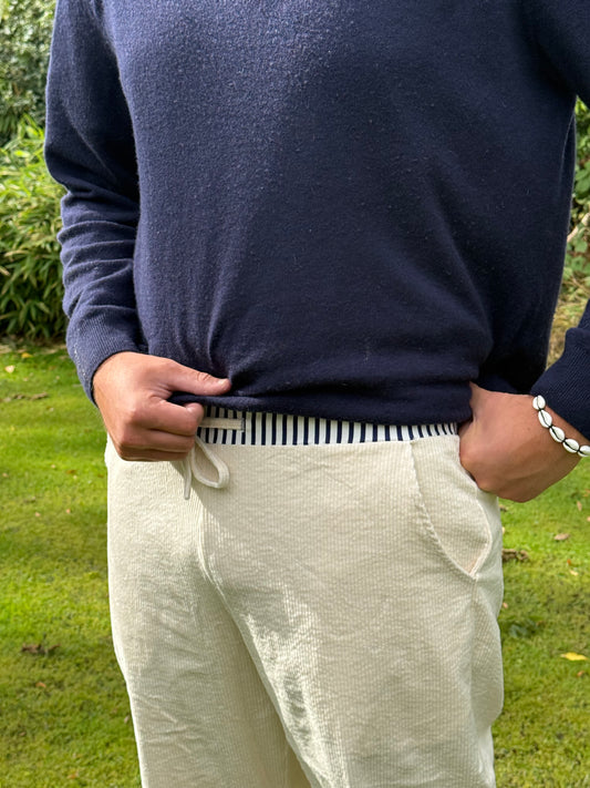 Cream jumbo cords with trademark stripe waistband