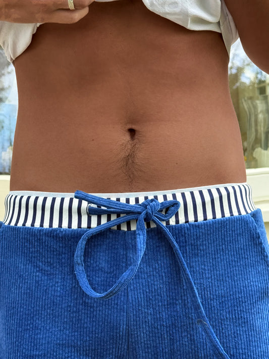 Bright blue cords with trademark stripe waistband