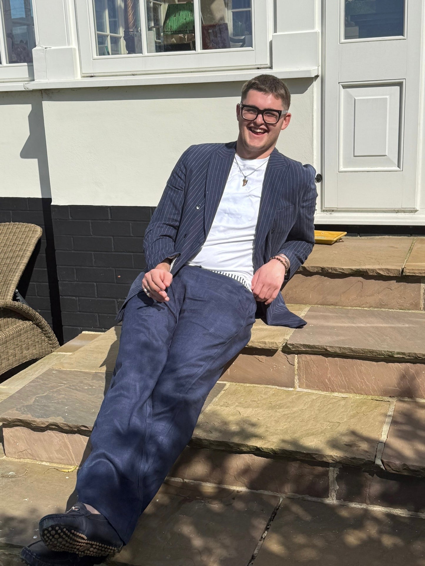 100%Navy linen trousers with our trademark striped waistband